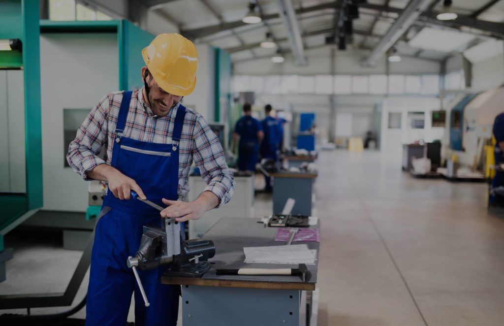 manufacturing employee working in a warehouse.
