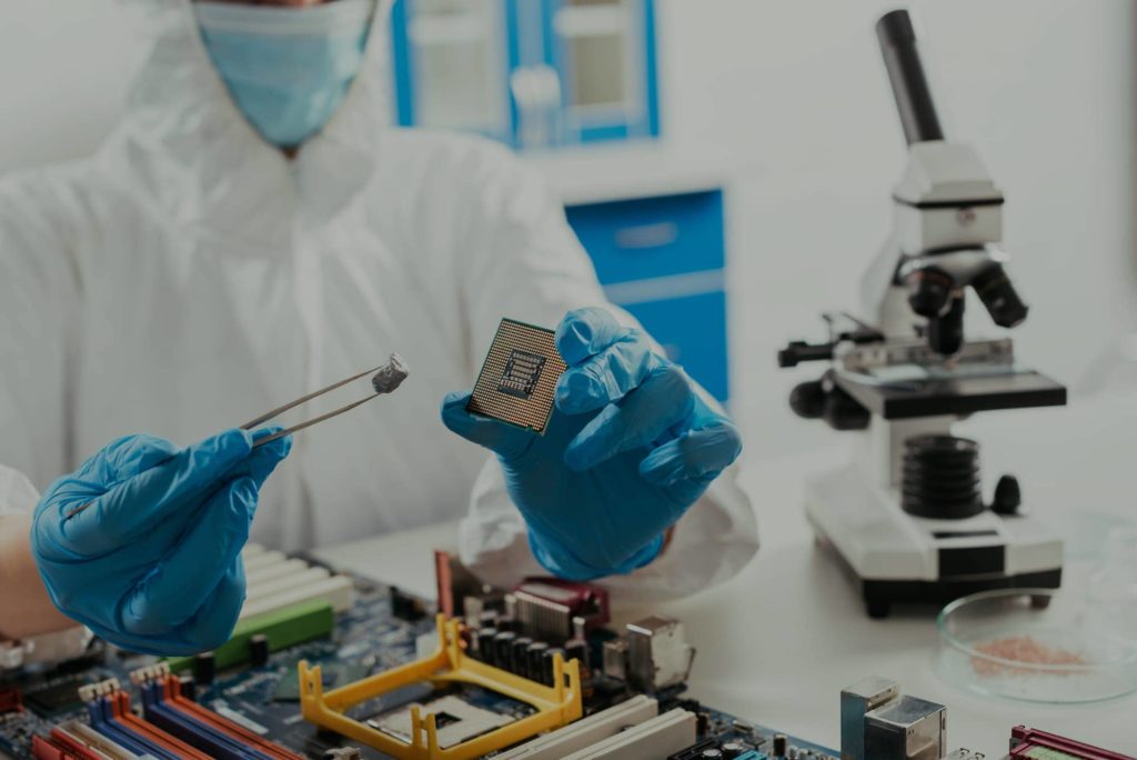 Employee working on building a semiconductor.