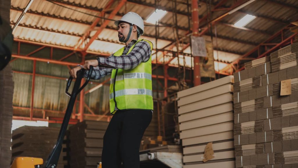 Plant manager working in a warehouse.