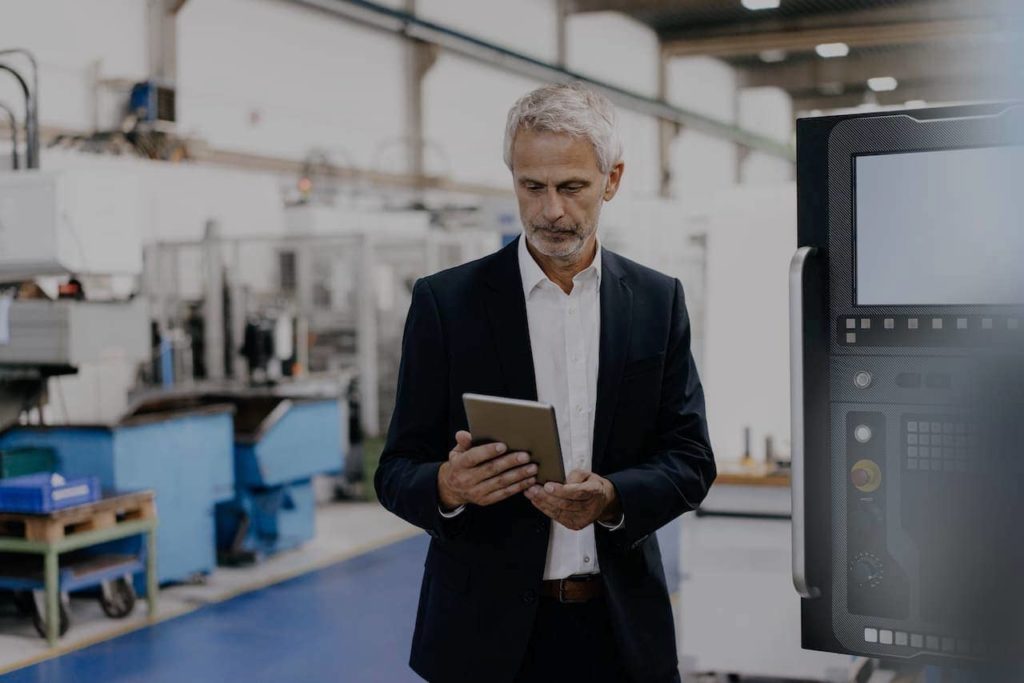 Manufacturing recruiter looking at a tablet.