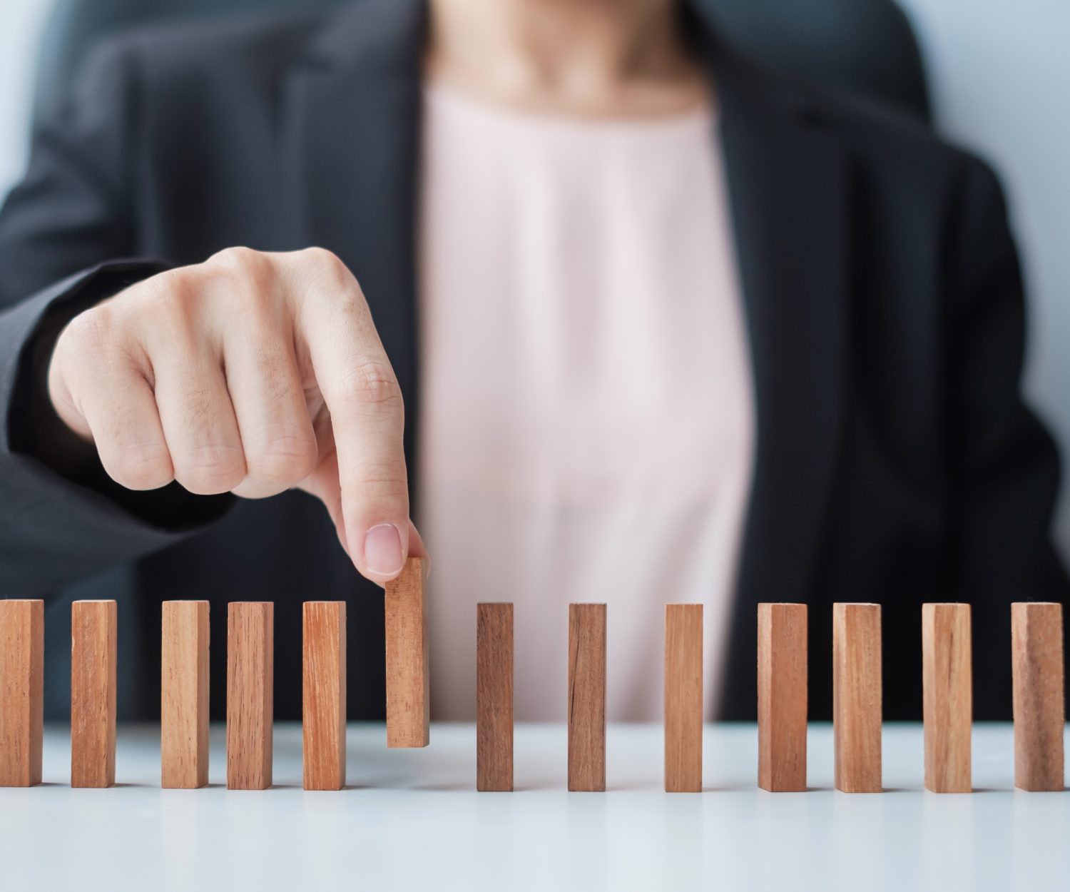 Businesswoman hand pulling leader man wooden from crowd of block. Toxic People, Human resource management, Recruitment, Teamwork and leadership Concepts (Businesswoman hand pulling leader man wooden from crowd of block. Toxic People, Human resource ma
