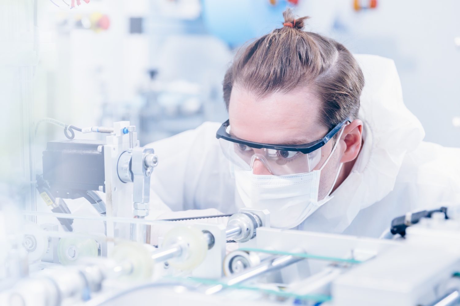 Engineering scientist working with advanced technology medical device in science laboratory for experimental research. (Engineering scientist working with advanced technology medical device in science laboratory for experimental research., ASCII, 119