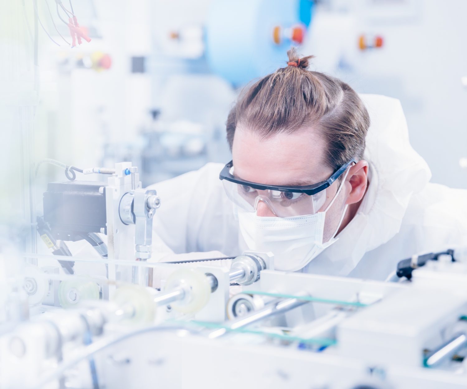 Engineering scientist working with advanced technology medical device in science laboratory for experimental research. (Engineering scientist working with advanced technology medical device in science laboratory for experimental research., ASCII, 119